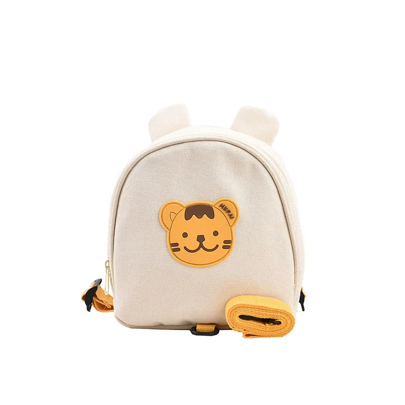 Mini sac à dos bébé tigre en nylon crème avec oreilles 3D, badge ourson en relief et laisse de sécurité détachable, vue de face