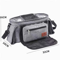 Organisateur de poussette gris avec dimensions 32 cm de large, 16 cm de haut et 10 cm de profondeur