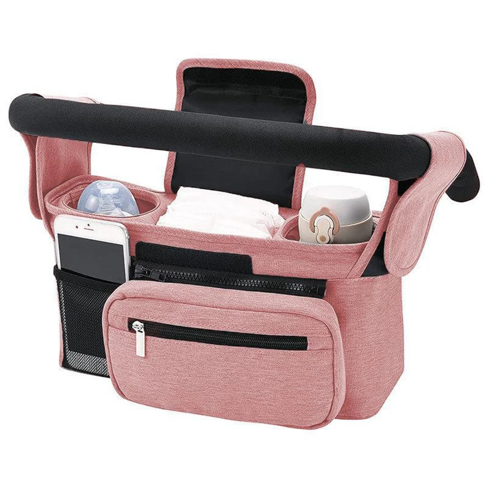 Organisateur de poussette rose avec compartiments pour biberon, lingettes et smartphone