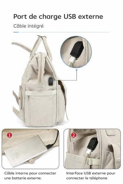 Sac à dos à langer beige avec port USB externe et câble intégré permettant de connecter une batterie externe pour recharger un téléphone en déplacement