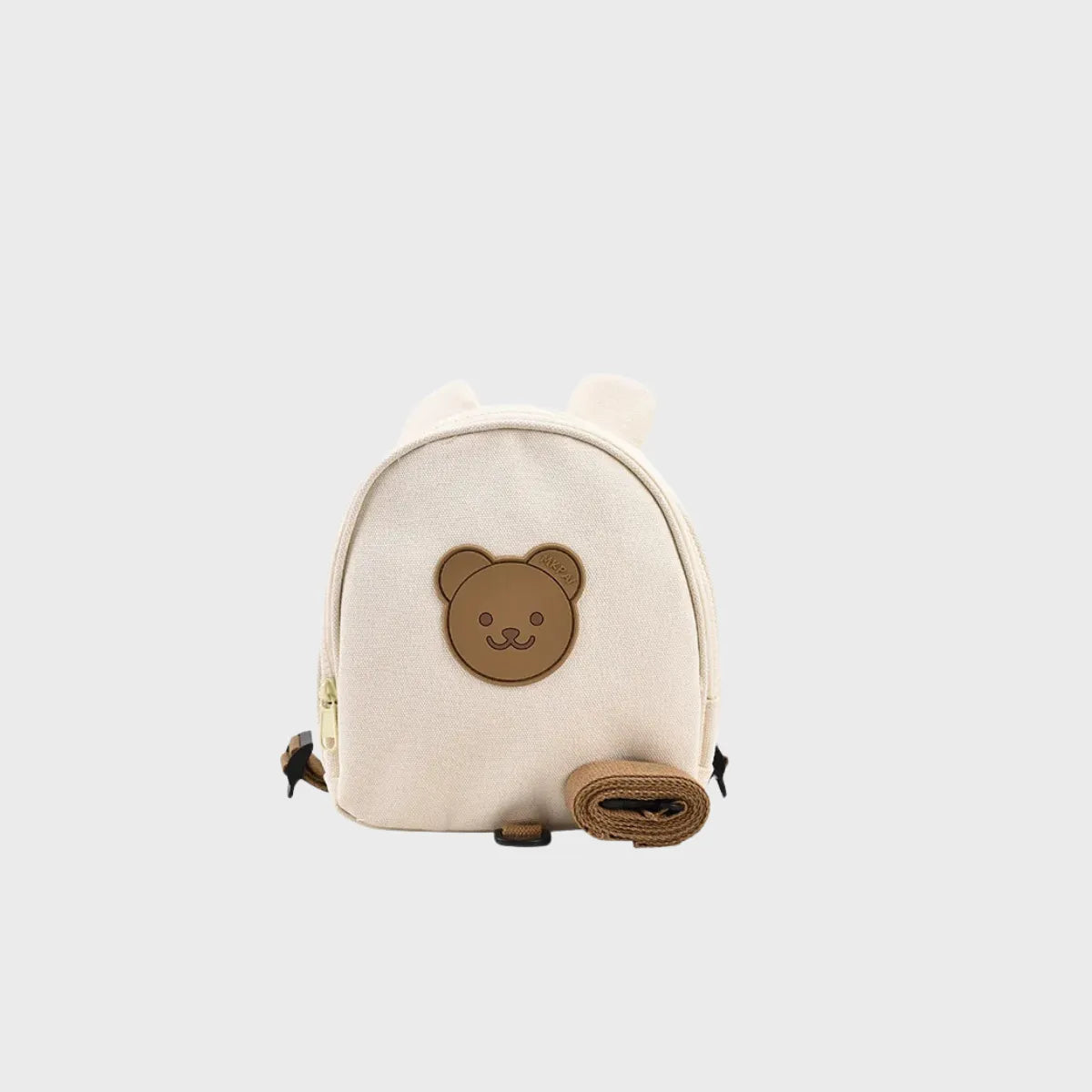 Mini sac à dos bébé ourson en nylon crème avec oreilles 3D, badge ourson en relief et laisse de sécurité détachable, vue de face