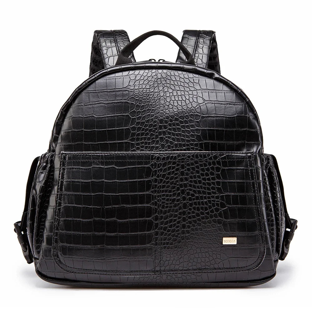 Sac à dos à langer cuir vieilli noir serpent sur fond lanc