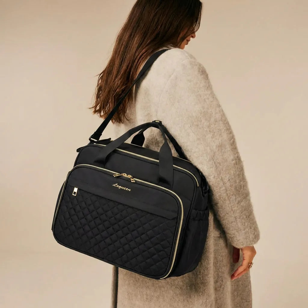 Sac à langer noir porté en bandoulière, grande capacité, zips dorés et motif matelassé