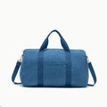 Sac à langer en velours côtelé bleu pétrole avec bandoulière réglable à mousquetons, poignées rigides et poche extérieure - format tote bag spacieux et élégant