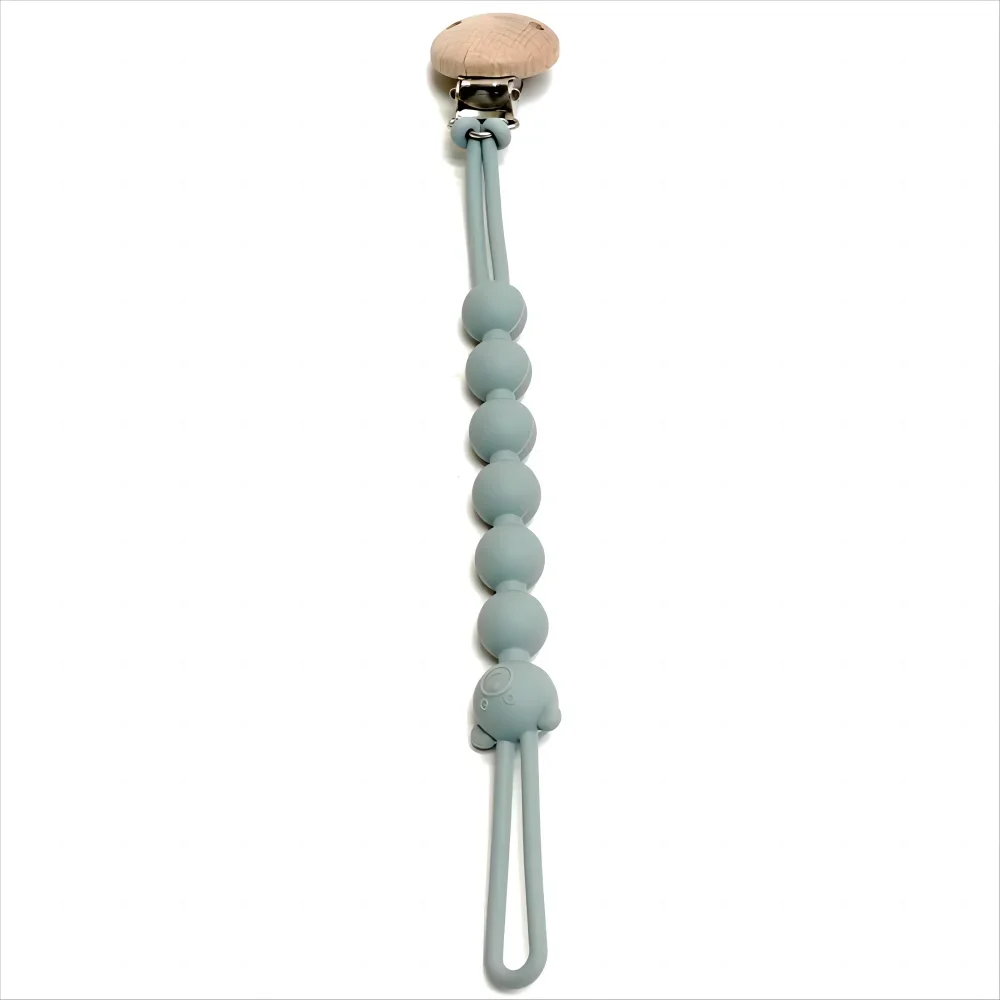 attache tétine bleu nuit sur fond blanc