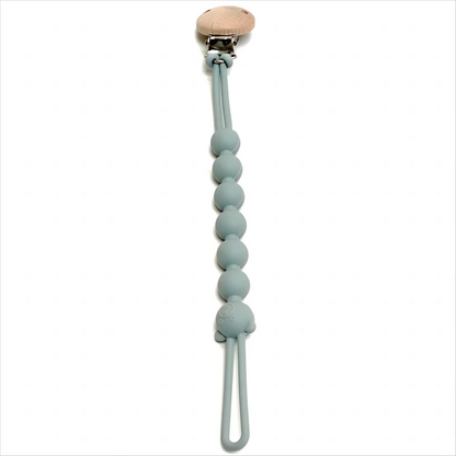 attache tétine bleu nuit sur fond blanc