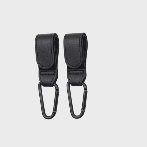 attaches poussettes noir sur fond blanc