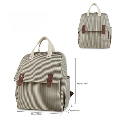 Sac à dos à langer rayé en polyester avec dimensions 30x38x15 cm et détails des poignées cuir PU