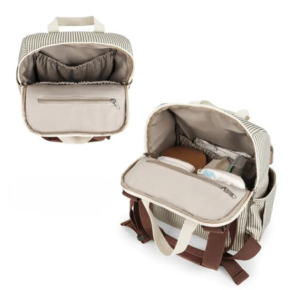 Intérieur du sac à dos à langer rayé avec compartiments organisés, poche zippée et espace rangement couches et accessoires bébé