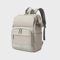 Sac à dos à langer ergonomique de couleur beige avec logo Happy Baby, multiples fermetures éclair et design compact