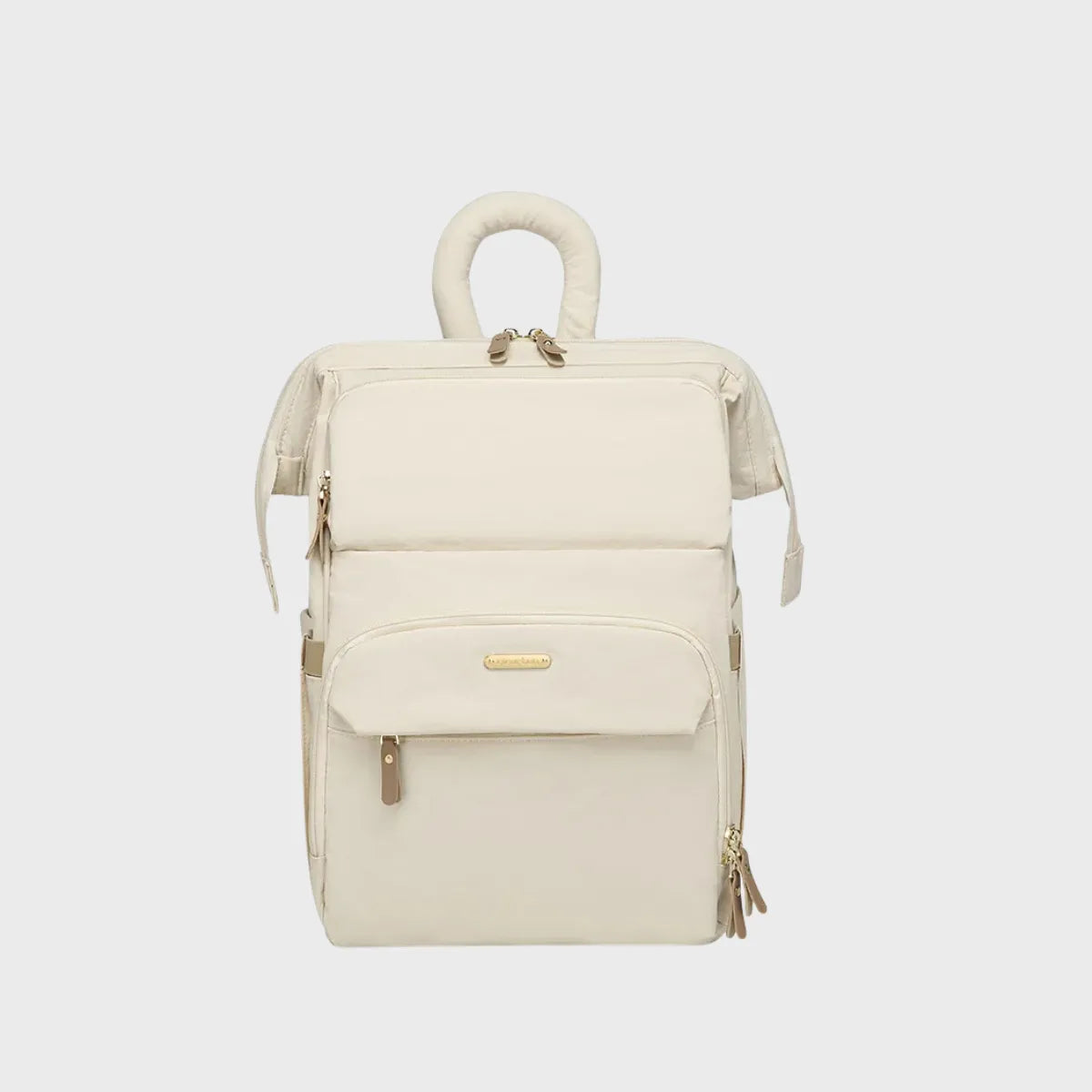sac a dos a langer matelassé beige sur fond gris