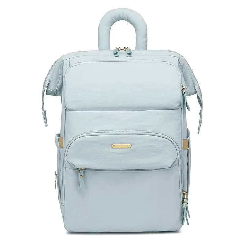 sac a dos a langer matelassé bleu sur fond gris