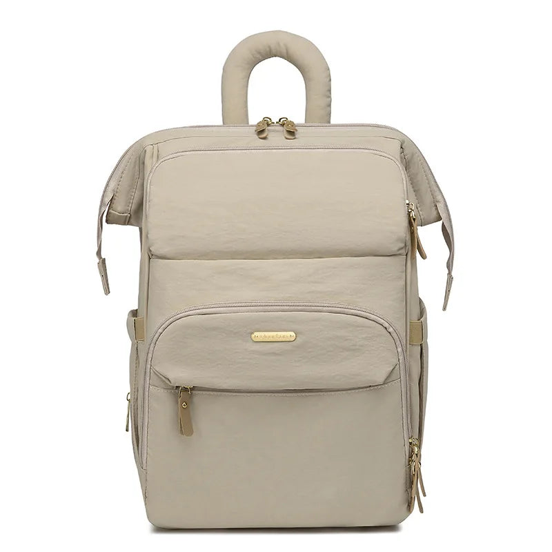 sac a dos a langer matelassé kaki sur fond gris