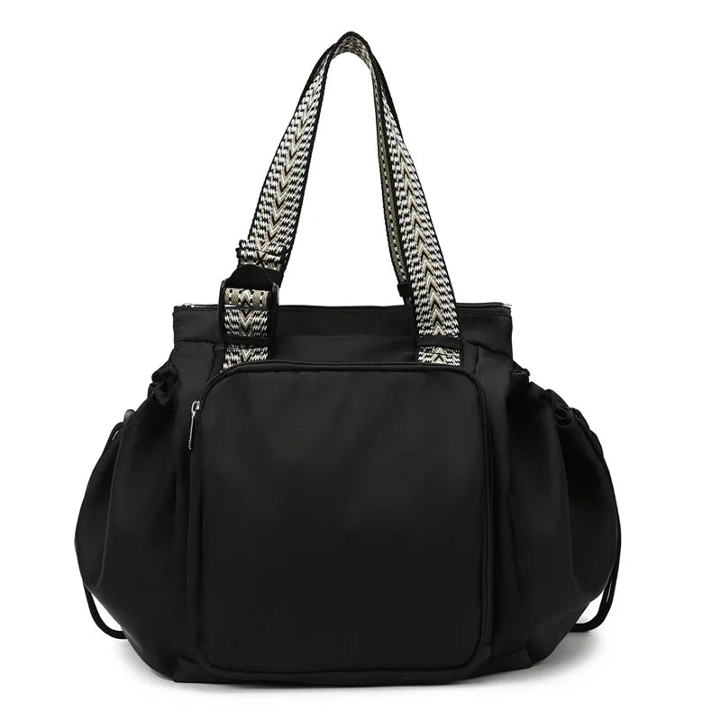 sac à dos à langer 3 en 1 noir sur fond blanc