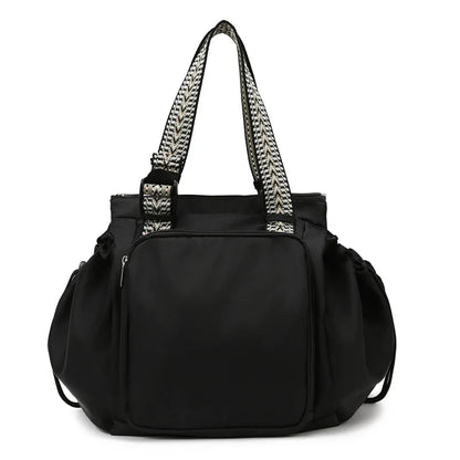 sac à dos à langer 3 en 1 noir sur fond blanc