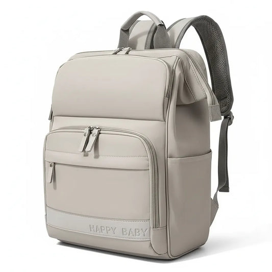 Sac à dos à langer ergonomique de couleur beige avec logo Happy Baby, multiples fermetures éclair et design compact.