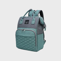 sac à dos à langer vert & gris sur fond blanc