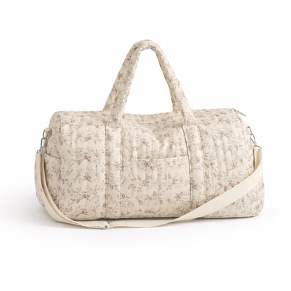 sac à langer fleuri gaze de coton sur fond blanc